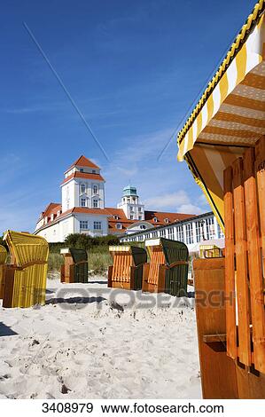 Hooded Beach Chairs on the beach of Binz, spa hotel in the background, Ruegen, Germany View Large Photo Image Stock Photo - Hooded Beach Chairs on the beach of Binz, spa hotel in the background, Ruegen, Germany . Fotosearch