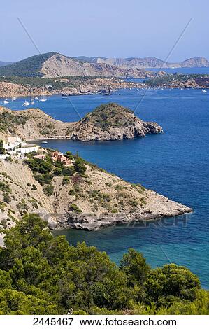 Islands in sea, Es Cubells, Ibiza, Balearic Islands, Spain View Large Photo Image Stock Photo - Islands in sea, Es Cubells, Ibiza, Balearic Islands, Spain . Fotosearch