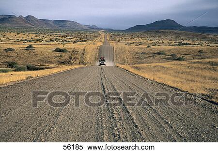 Stock Photography - Land vehicle traveling on a countryroad . Fotosearch