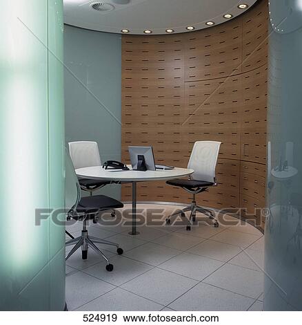 Stock Photo - Landline phone and computer on table in office . Fotosearch