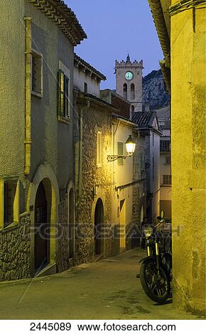 Lantern lit up on wall at dusk, Valldemossa, Majorca, Balearic Islands, Spain View Large Photo Image Stock Photo - Lantern lit up on wall at dusk, Valldemossa, Majorca, Balearic Islands, Spain . Fotosearch