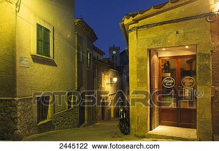 Lantern lit up on wall at night, Valldemossa, Majorca, Balearic Islands, Spain View Large Photo Image Stock Image - Lantern lit up on wall at night, Valldemossa, Majorca, Balearic Islands, Spain . Fotosearch