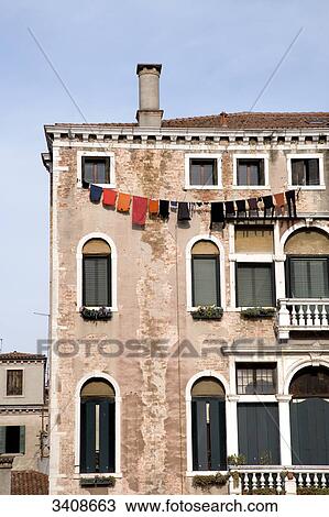 Laundry drying on a house facade, Venice, Italy, low angle view View Large Photo Image Stock Image - Laundry drying on a house facade, Venice, Italy, low angle view . Fotosearch