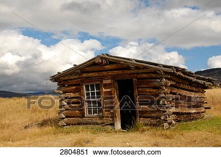 Stock Image - Log cabin in ghost town, Nevada City, Montana, USA . Fotosearch
