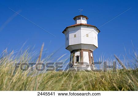 Stock Image - Low angle view of lighthouse, Langeoog, Lower Saxony, Germany . Fotosearch