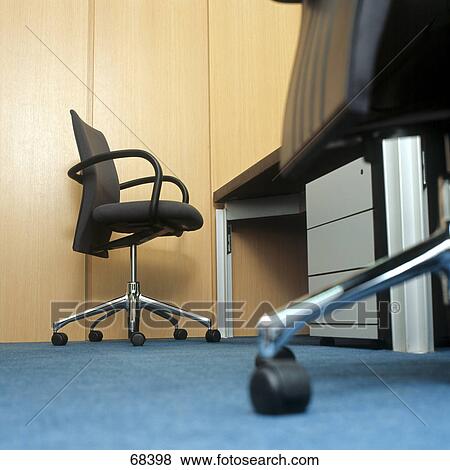 Low angle view of office chair View Large Photo Image Stock Photo - Low angle view of office chair . Fotosearch