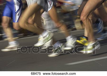 Low section view of athletics running in marathon View Large Photo Image Stock Photography - Low section view of athletics running in marathon . Fotosearch