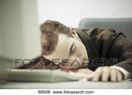 Man sleeping in office View Large Photo Image Stock Photograph - Man sleeping in office . Fotosearch