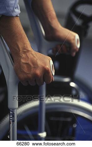 man using his crutches, close-up View Large Photo Image Stock Image - man using his crutches, close-up . Fotosearch