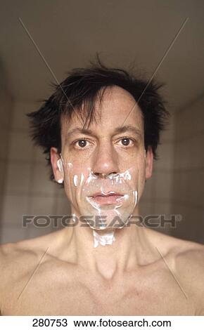 Stock Image - Man with shaving foam looking at camera . Fotosearch