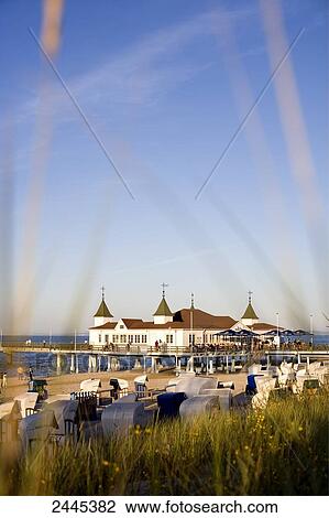 Marram grass and hooded beach chairs on beach with pier in background, Ahlbeck, Usedom, Mecklenburg-West Pomerania, Germany View Large Photo Image Stock Image - Marram grass and hooded beach chairs on beach with pier in background, Ahlbeck, Usedom, Mecklenburg-West Pomerania, Germany . Fotosearch