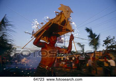 Mid adult man dancing in religious procession with fireworks, Nicaragua View Large Photo Image Stock Image - Mid adult man dancing in religious procession with fireworks, Nicaragua . Fotosearch