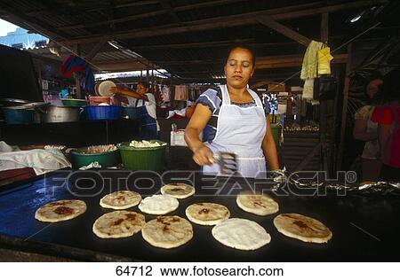 Mid adult woman baking breads View Large Photo Image Stock Image - Mid adult woman baking breads . Fotosearch
