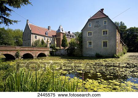 Stock Photography - Moated castle at waterfront, Senden, Muenster, North Rhine-Westphalia, Germany . Fotosearch