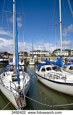 Stock Image - Moored yachts at the marina of Munkmarsch, Sylt, Germany . Fotosearch