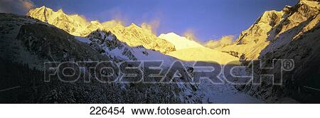 Mountain range during winter against blue sky, China View Large Photo Image Picture - Mountain range during winter against blue sky, China . Fotosearch
