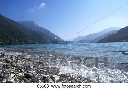 Stock Photo - Mountains near lake, Garda Lake, Italy . Fotosearch