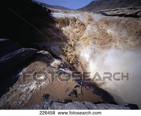 Muddy river water cascading over rocks, Hukou Falls, China View Large Photo Image Stock Photo - Muddy river water cascading over rocks, Hukou Falls, China . Fotosearch
