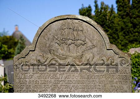 Old gravestone at the cemetery of St. Clement Church, Nebel, Amrum, Germany, detail View Large Photo Image Stock Photo - Old gravestone at the cemetery of St. Clement Church, Nebel, Amrum, Germany, detail . Fotosearch