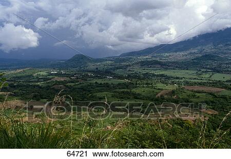Stock Image - Overcast sky above valley, El Salvador . Fotosearch