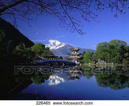 Stock Photography - Pagoda and bridge across river, Black Dragon Pool, Lijang, Yunnan, China . Fotosearch