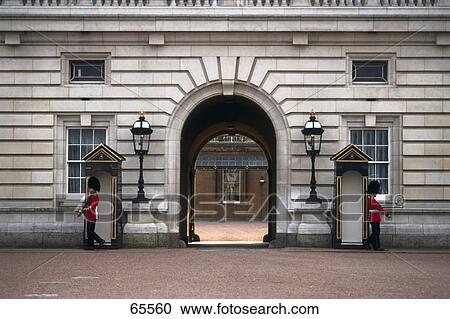 Palace guards at archway entrance of palace, Buckingham Palace, London, England View Large Photo Image Stock Image - Palace guards at archway entrance of palace, Buckingham Palace, London, England . Fotosearch