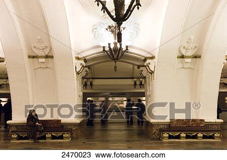 Stock Image - Passengers waiting at subway station, Arbatskaya, Arbatskoâ€“Pokrovskaya Line, Moscow, Russia . Fotosearch