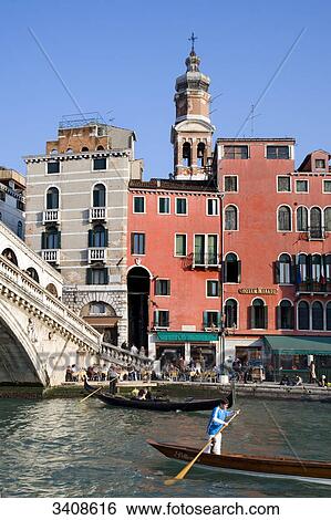Pavement cafe at the Rialto Bridge, gondolas on the Canale Grande in the foreground, Venice, Italy View Large Photo Image Stock Photograph - Pavement cafe at the Rialto Bridge, gondolas on the Canale Grande in the foreground, Venice, Italy . Fotosearch