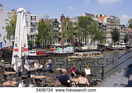 Picture - Pavement cafe De Sluyswacht, Amsterdam, Netherlands, elevatde view . Fotosearch