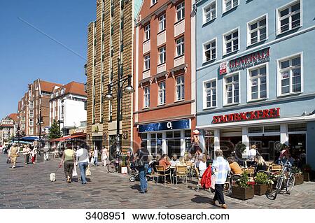 Stock Image - Pavement cafes in a pedestrian area, Rostock, Germany . Fotosearch