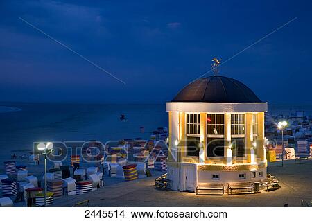 Pavilion and hooded beach chairs on beach at night, Borkum, Lower Saxony, Germany View Large Photo Image Picture - Pavilion and hooded beach chairs on beach at night, Borkum, Lower Saxony, Germany . Fotosearch