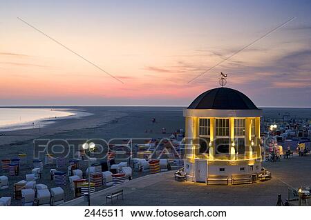 Pavilion and hooded beach chairs on beach at dusk, Borkum, Lower Saxony, Germany View Large Photo Image Stock Image - Pavilion and hooded beach chairs on beach at dusk, Borkum, Lower Saxony, Germany . Fotosearch