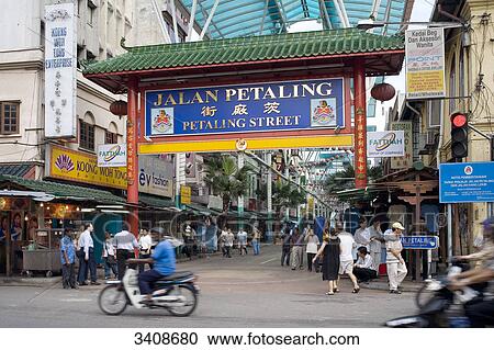 Stock Image - Pedestrians in a shopping street, Chinatown, Kuala Lumpur, Malaysia . Fotosearch