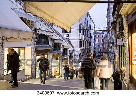 Stock Photo - Pedestrians in an alley, Venice, Italy, elevated view . Fotosearch
