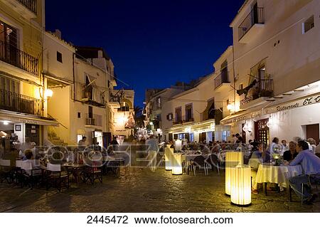 Stock Image - People at restaurant, Dalt Vila, Ibiza, Spain . Fotosearch