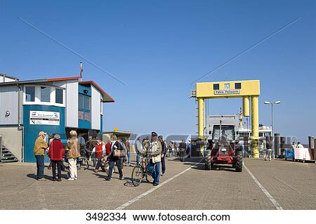 People at the harbour of Strucklahnungshoern, Nordstrand, Schleswig-Holstein, Germany View Large Photo Image Picture - People at the harbour of Strucklahnungshoern, Nordstrand, Schleswig-Holstein, Germany . Fotosearch