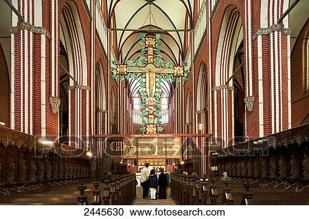 Stock Image - People in church, Bad Doberan, Muenster, Mecklenburg-Western Pomerania, Germany . Fotosearch
