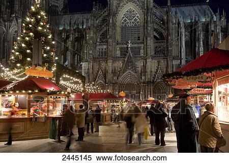 People in front of church at Christmas time, Cologne Cathedral, Cologne, North Rhine-Westphalia, Germany View Large Photo Image Stock Photography - People in front of church at Christmas time, Cologne Cathedral, Cologne, North Rhine-Westphalia, Germany . Fotosearch