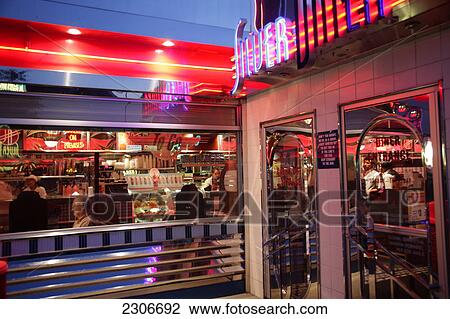 Stock Image - People in restaurant, USA . Fotosearch