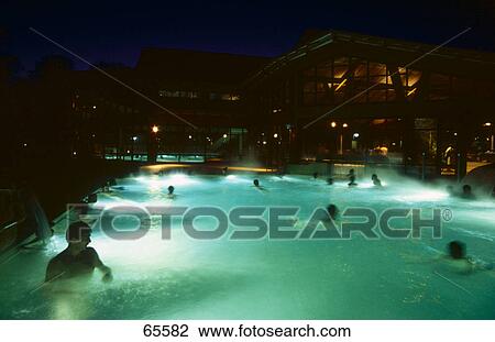 Stock Image - People in swimming pool, Freiburg, Baden-Wurttemberg, Germany . Fotosearch