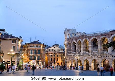 Stock Image - People on a square (Piazza Bra) at the amphitheatre, Verona, Italy . Fotosearch