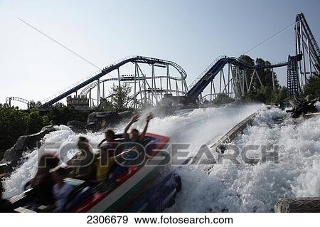 Stock Photo - People on amusement park water ride . Fotosearch