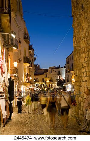 People walking in street, Dalt Vila, Ibiza, Spain View Large Photo Image Picture - People walking in street, Dalt Vila, Ibiza, Spain . Fotosearch
