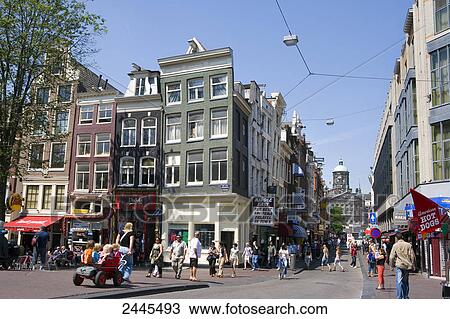 People walking in street, Damstraat, Amsterdam, Netherlands View Large Photo Image Stock Image - People walking in street, Damstraat, Amsterdam, Netherlands . Fotosearch