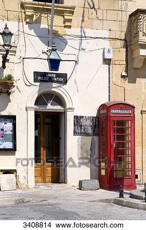 Phone box in front of a police station, Gharb, Gozo, Malta View Large Photo Image Picture - Phone box in front of a police station, Gharb, Gozo, Malta . Fotosearch