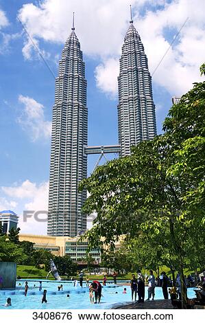 Stock Photograph - Pool in front of the Petronas Towers, Kuala Lumpur, Malaysia, low angle view . Fotosearch