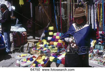 Stock Image - Portrait of female shopkeeper in front of market stall, Guamote, Ecuador . Fotosearch