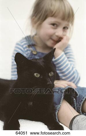Portrait of girl sitting with cat and smiling View Large Photo Image Stock Image - Portrait of girl sitting with cat and smiling . Fotosearch