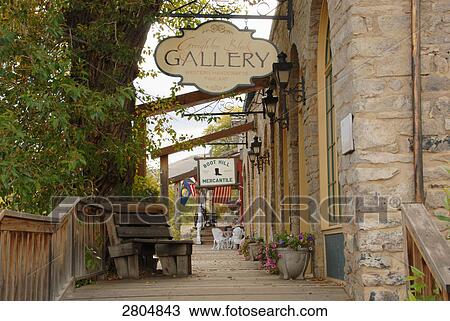 Stock Image - Potted plants in front of stores in ghost town, Montana, USA . Fotosearch