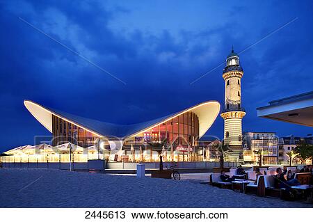 Restaurant and lighthouse at waterfront, Teepott, Warnemunde, Schusters Strandbar, Rostock, Mecklenburg-West Pomerania, Germany View Large Photo Image Stock Image - Restaurant and lighthouse at waterfront, Teepott, Warnemunde, Schusters Strandbar, Rostock, Mecklenburg-West Pomerania, Germany . Fotosearch